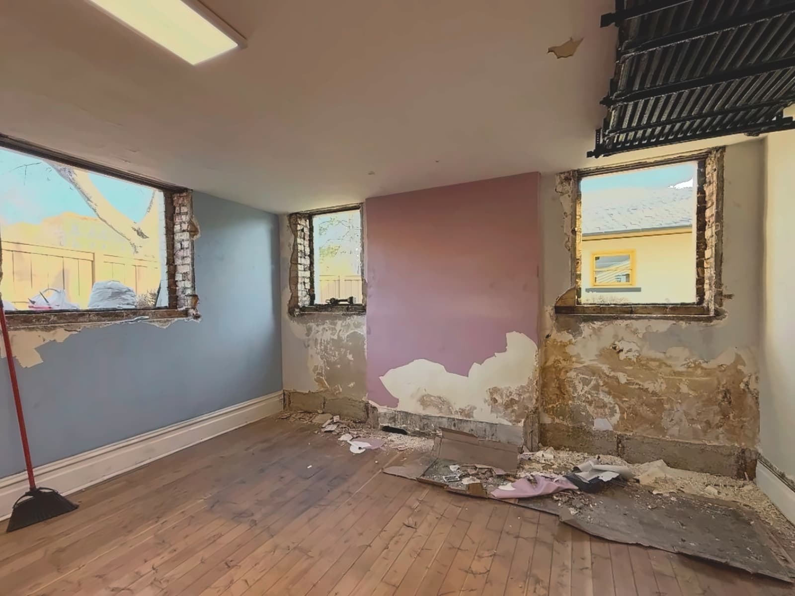 Plaster failed back to the substrate around every window opening.