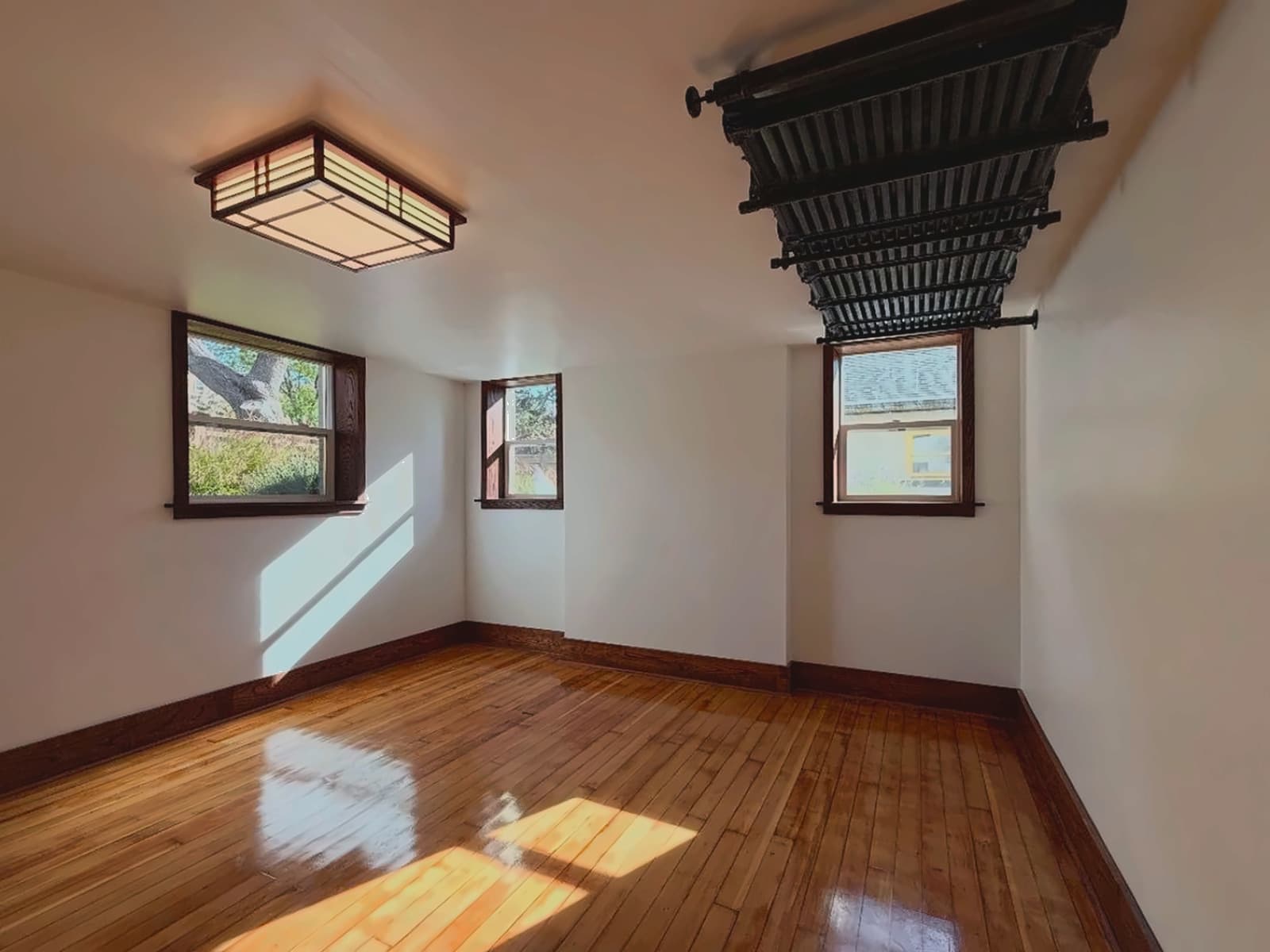Clean walls, trim square to the light, and the original floor brought back.