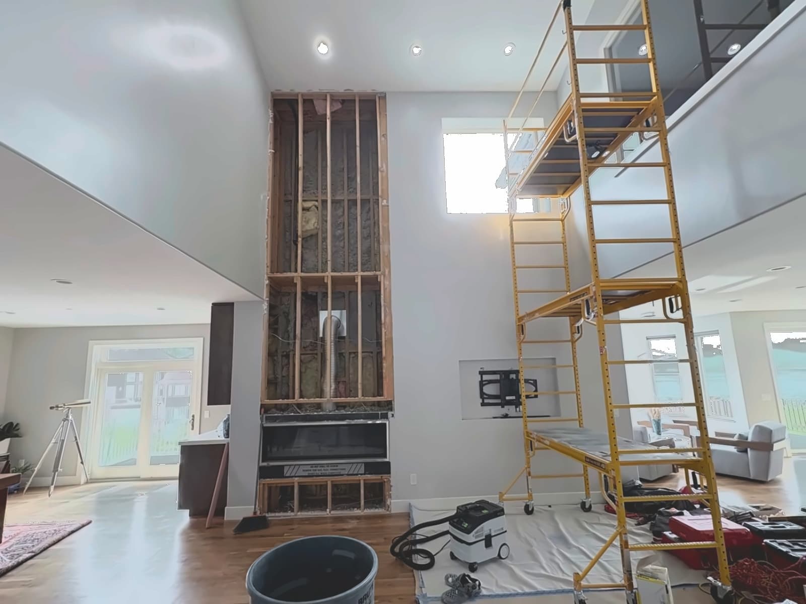 Framing and scaffolding up, the wall roughed in and waiting on finish.